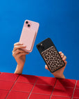 Posh Tech magnetic power banks in pink and leopard print on iPhones
