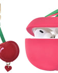 Cherry and fruit detail close-up on AirTag® and AirPods charm bundle