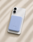 Ice blue ultra slim magnetic power bank charging iPhone wirelessly