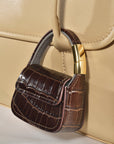 Brown croc mini purse AirPods case clipped closed, back view