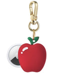 Posh Tech red Apple silicone AirTag bag charm shown with AirTag inserted, green leaf detail