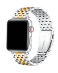 A stainless steel link watch band with a two-tone silver and gold finish, shown on a silver smartwatch with a black screen against a plain white background.