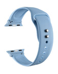 Ice blue silicone Apple Watch® band unclasped, flat-lay view showing pin-and-tuck closure and size adapters