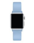 Ice blue silicone Apple Watch® band fastened on the watch case, angled side view showing pin-and-tuck closure