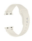 Ivory silicone Apple Watch® band unclasped, flat-lay view showing pin-and-tuck closure and size adapters