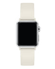 Ivory silicone Apple Watch® band fastened on the watch case, angled side view showing pin-and-tuck closure