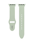 Sage green silicone Apple Watch® band close-up, detail view of molded texture and pin closure holes