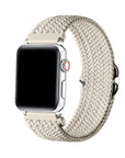 Oatmilk braided nylon loop Apple Watch band worn on wrist, angled view showing adjustable buckle