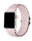 Light Pink braided nylon loop Apple Watch band worn on wrist, angled view showing adjustable buckle