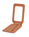 Brown MagSafe magnetic wallet open showing compact mirror inside