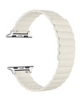 An ivory silicone watch band with a wavy, scalloped edge and a silver metal connector, shown on a plain white background.