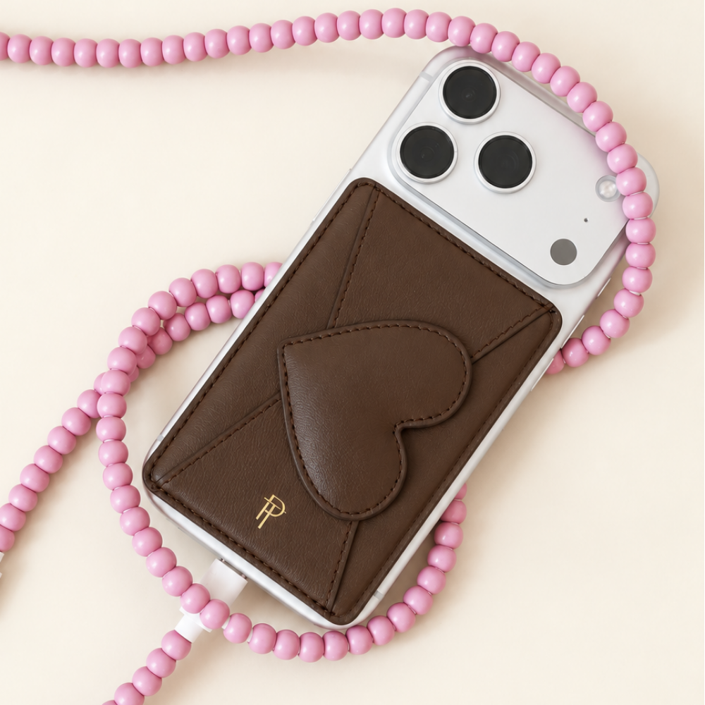 Brown Heart Leather Magnetic Phone Wallet on white iPhone with pink beaded phone strap