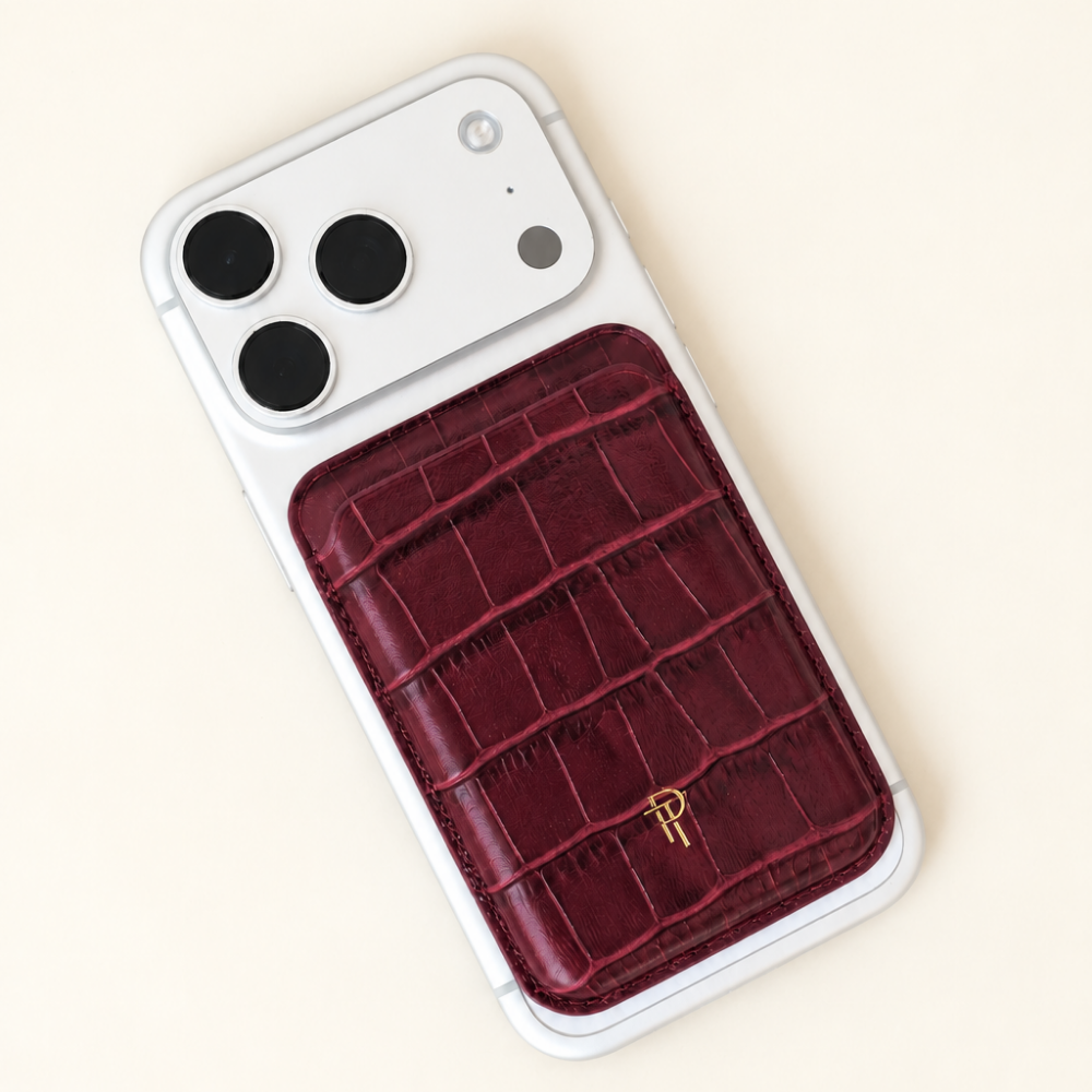 Cherry red Croc Leather Magnetic Phone Wallet attached to back of white iPhone