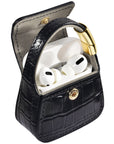 Open black croc purse charm showing AirPods Pro case inside