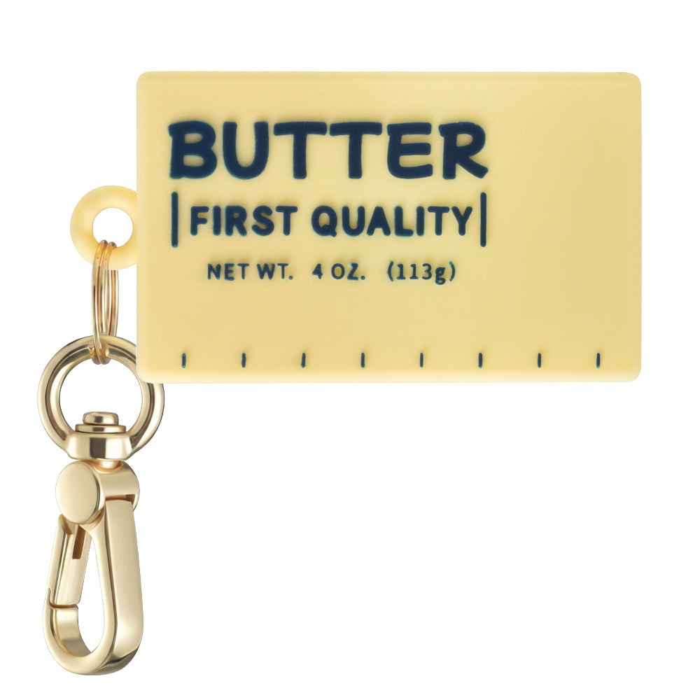 Posh Tech yellow silicone butter-stick bag charm for AirTag with retro First Quality label