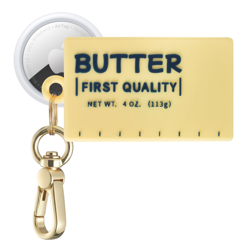 Posh Tech yellow Butter silicone AirTag bag charm shown with AirTag inserted, First Quality print