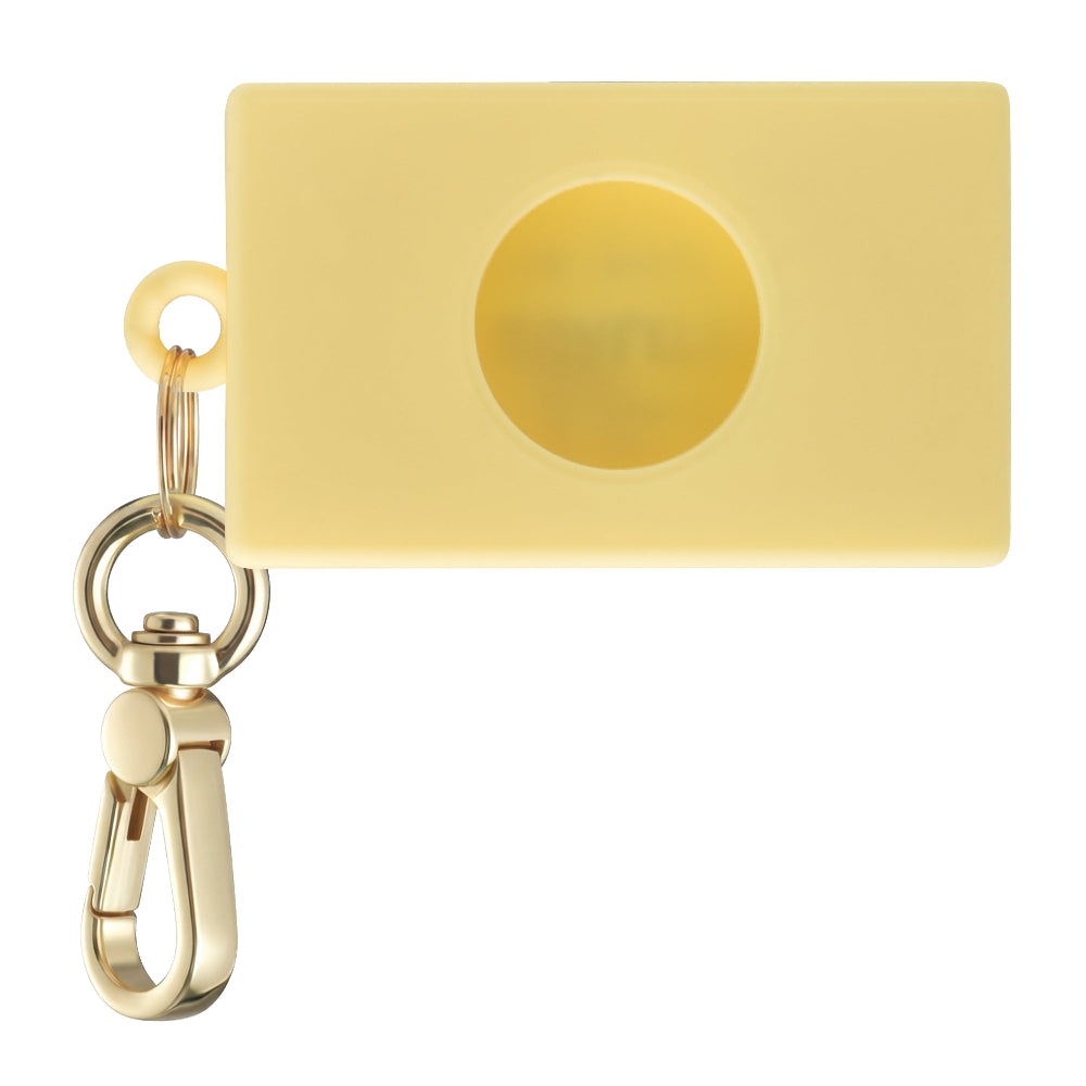 Back view of Butter silicone AirTag bag charm with cutout opening by Posh Tech