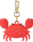 Posh Tech red silicone crab bag charm for AirTag with claws and polka dot finish