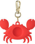 Back view of red silicone crab AirTag bag charm with cutout opening by Posh Tech