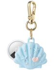 Posh Tech blue Seashell silicone AirTag bag charm shown with AirTag inserted, starfish and pearl detail