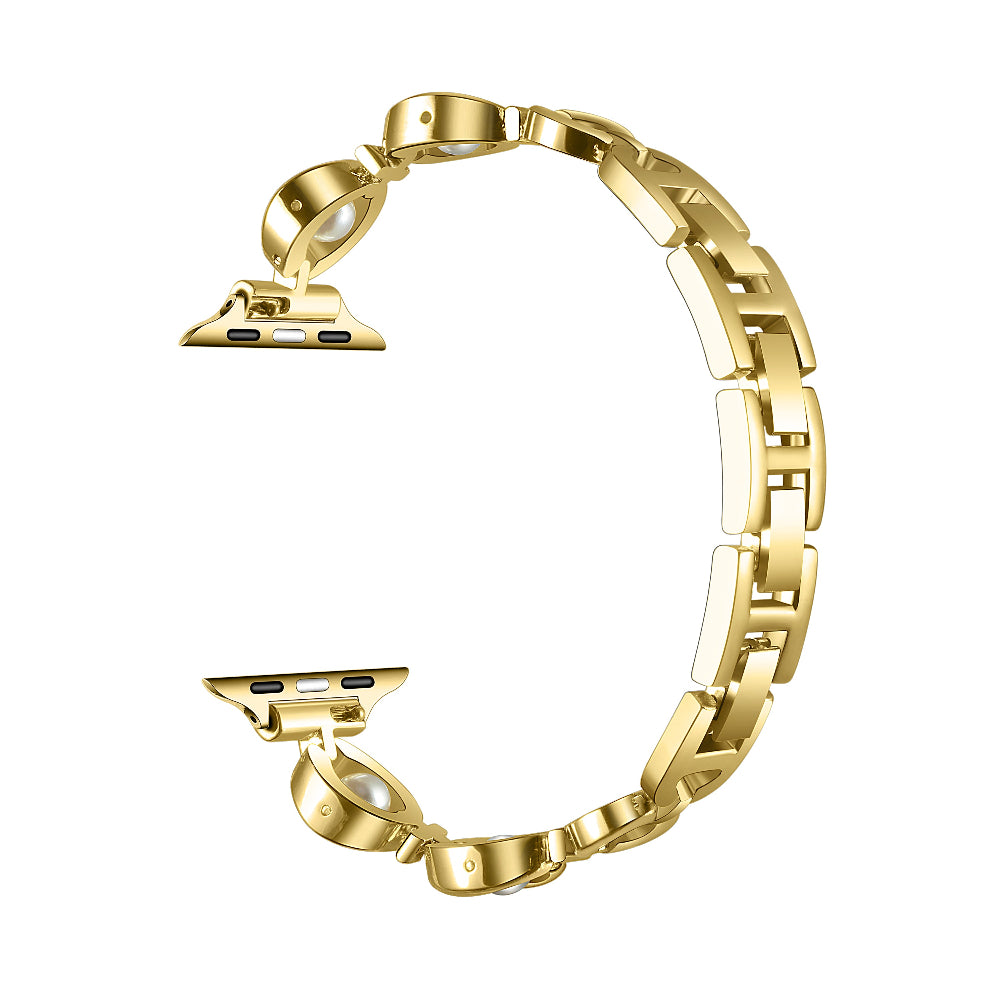Gold metal Apple Watch band with faux pearl detailing, shown unfastened