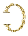 Gold metal Apple Watch band with faux pearl detailing, shown unfastened