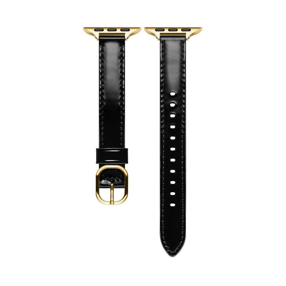 Black patent leather Apple Watch band laid flat, showing stitching and adjustable holes