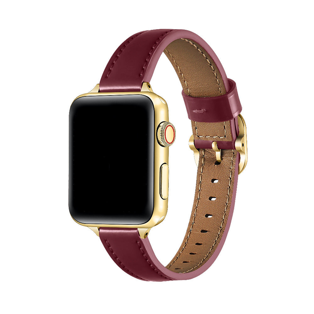 Carmen Patent Leather Band for Apple Watch in Cherry Lacquer, worn on watch showing glossy finish and gold hardware