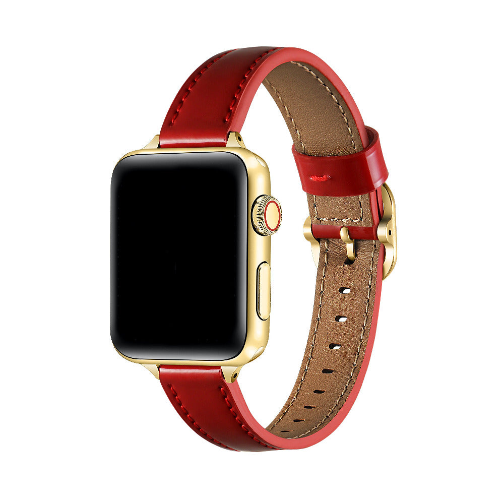 Carmen Patent Leather Band for Apple Watch in Crimson, worn on watch showing glossy patent leather and gold hardware