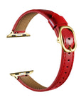 Crimson patent leather Apple Watch band, unclasped flat-lay view showing adjustable strap