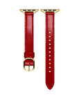 Crimson patent leather Apple Watch band laid flat, showing stitching and adjustable holes