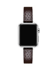 Apple Watch with Chocolate perforated leather band, top-down view showing silver case and black face