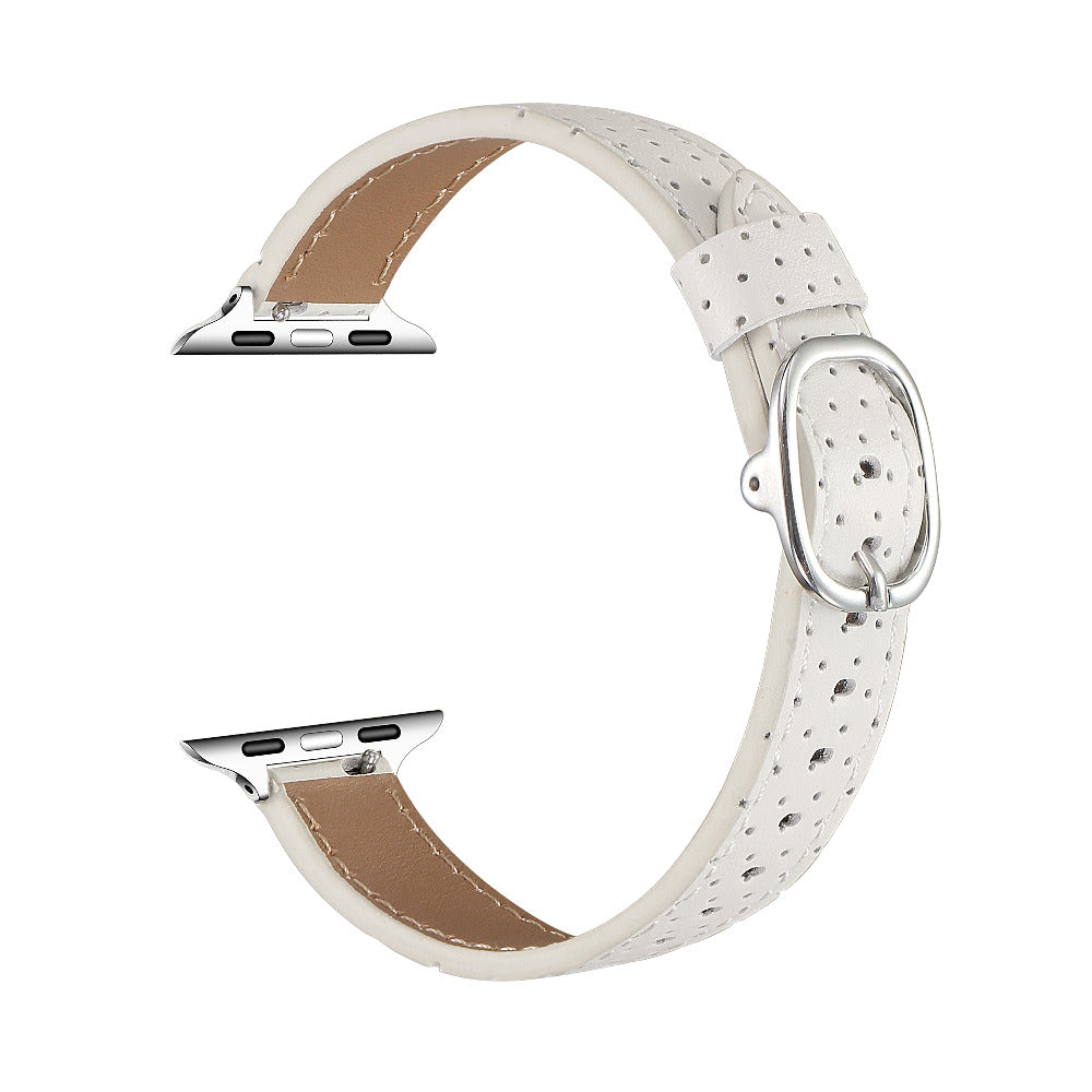 Ivory perforated leather Apple Watch band, unclasped flat-lay view showing adjustable strap