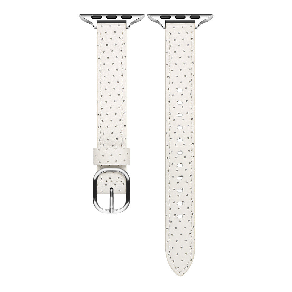 Ivory perforated leather Apple Watch band laid flat, showing perforation pattern and stitching
