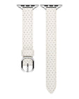Ivory perforated leather Apple Watch band laid flat, showing perforation pattern and stitching