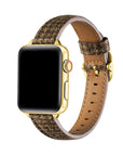 Carmen Tartan Apple Watch band in Caramel, worn on wrist with gold hardware