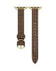 Close-up of Carmen Tartan Apple Watch band in Caramel showing tartan print and stitching