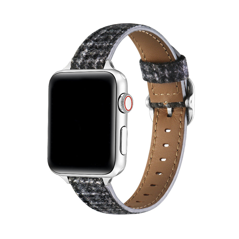 Carmen Tartan Apple Watch band in Midnight, worn on wrist with hardware