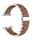 A curved stainless steel link watch band with a warm brown silicone inner lining, displayed on a clean white background.