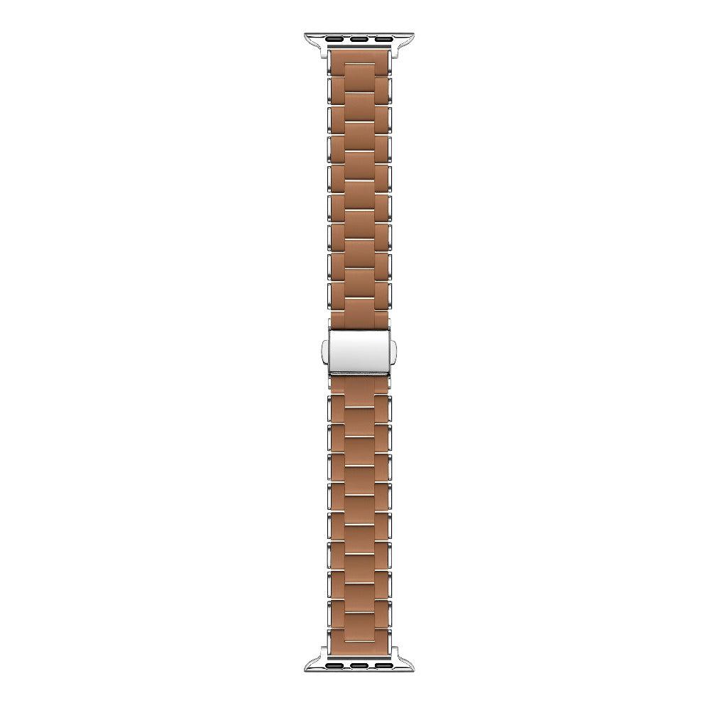 A brown leather watch strap with a silver metal buckle, shown vertically on a plain white background.