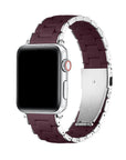 A silver smartwatch with a dark burgundy silicone link band, shown on a clean white background.