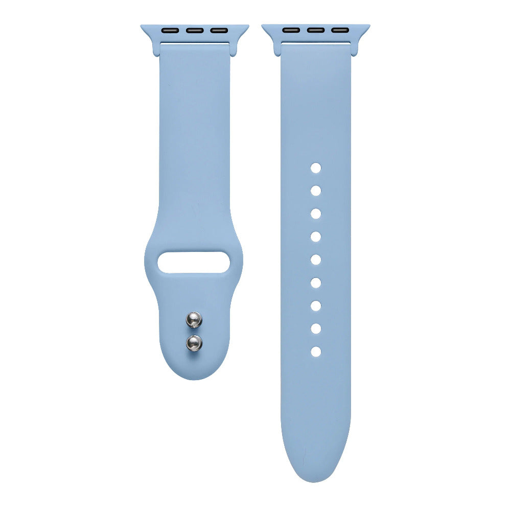 Ice blue silicone Apple Watch® band close-up, detail view of molded texture and pin closure holes