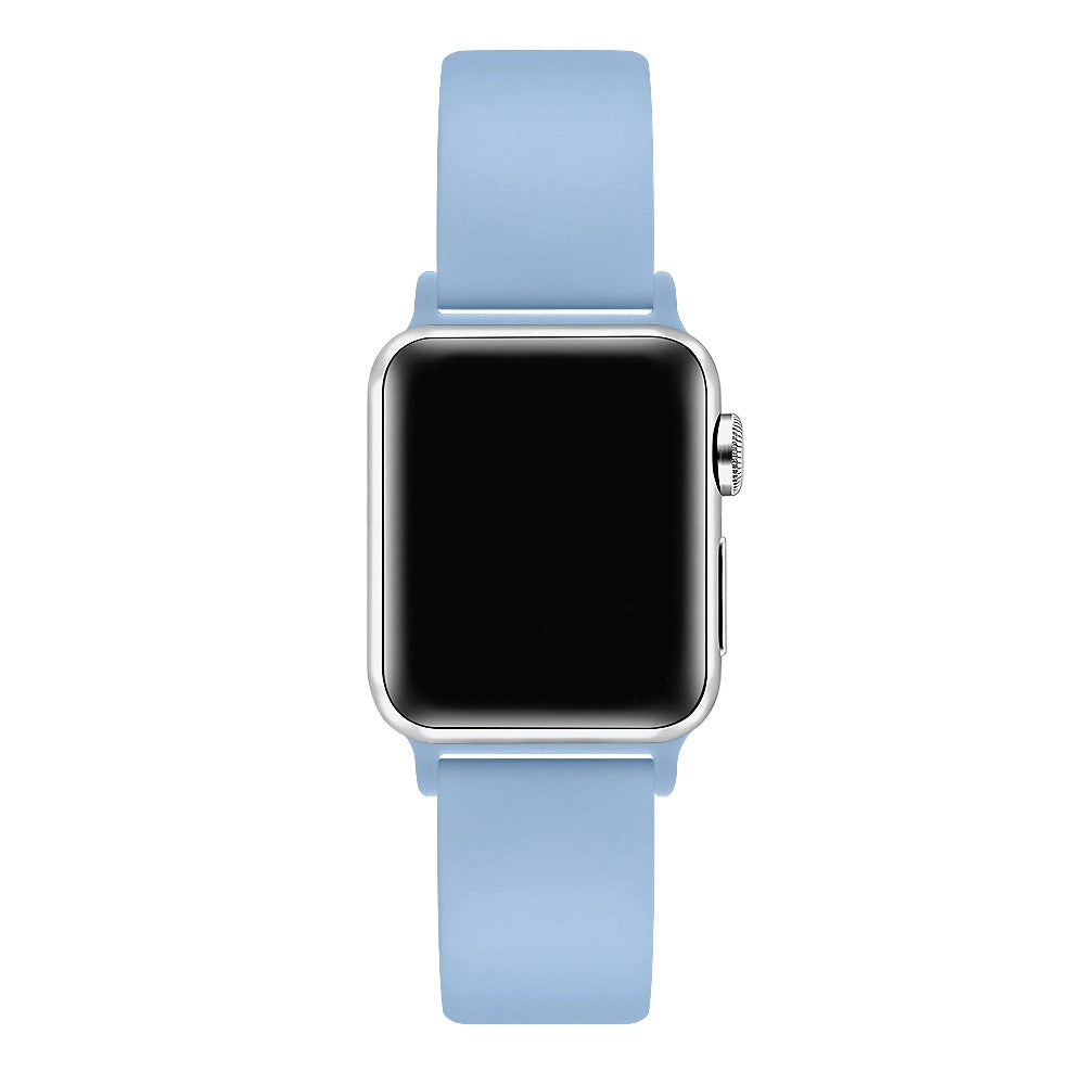 Ice blue silicone Apple Watch® band fastened on the watch case, angled side view showing pin-and-tuck closure