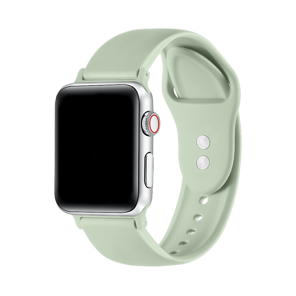 Sage green silicone Apple Watch® band fastened on the watch case, front view