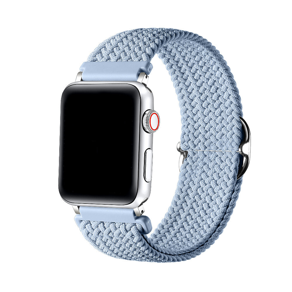 Aura Blue braided nylon loop Apple Watch band worn on wrist, angled view showing adjustable buckle
