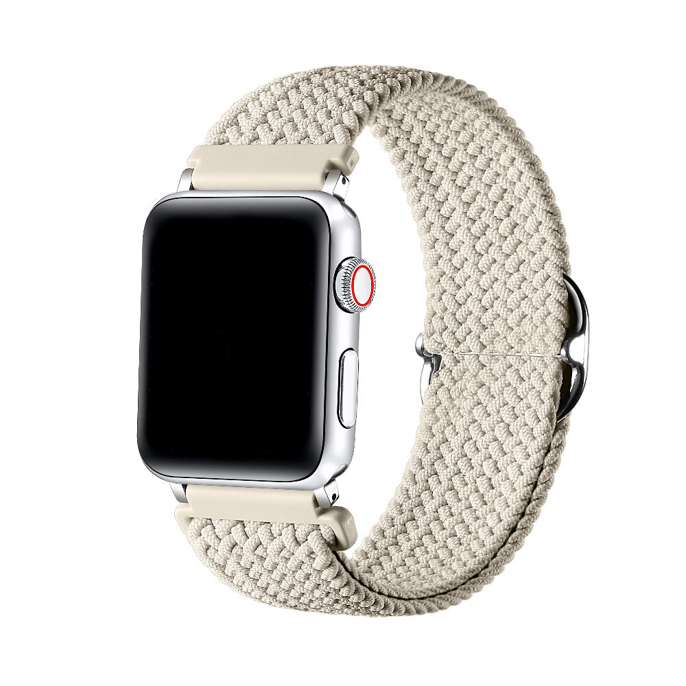 Oatmilk braided nylon loop Apple Watch band worn on wrist, angled view showing adjustable buckle
