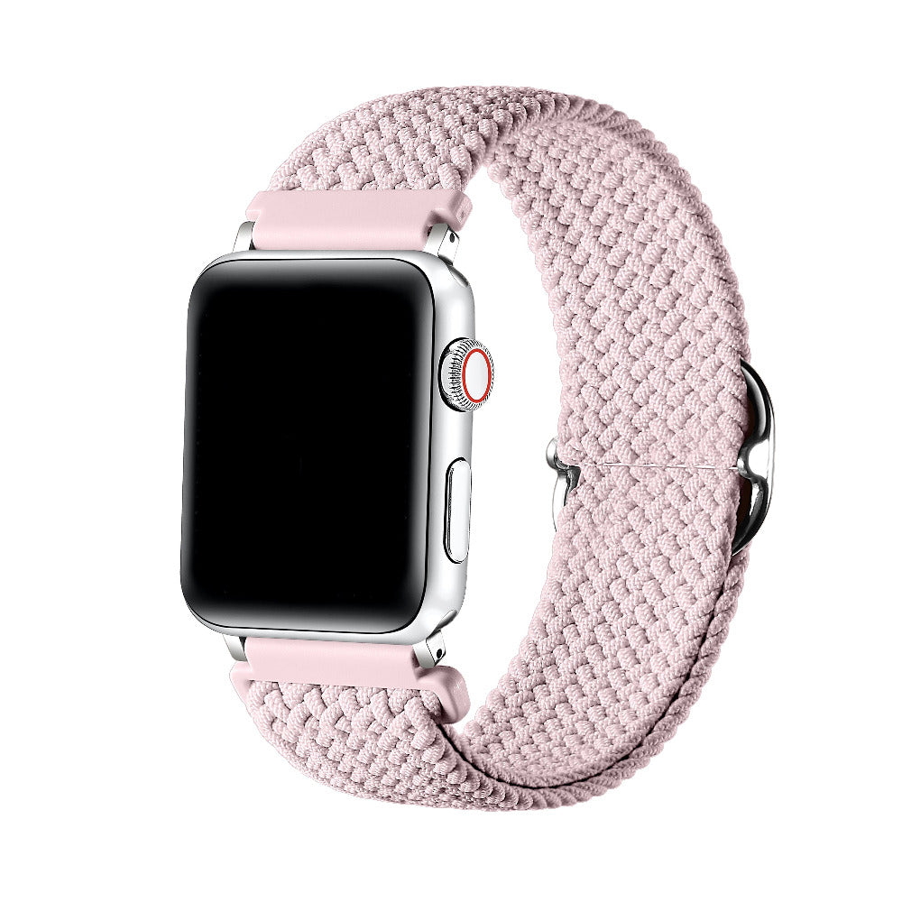 Light Pink braided nylon loop Apple Watch band worn on wrist, angled view showing adjustable buckle