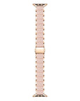 Rose gold stainless steel and pink silicone Apple Watch band flat layout
