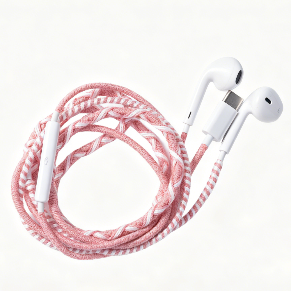 A braided multi-colored charging cable with white earbud-style connectors, coiled on a clean white background.