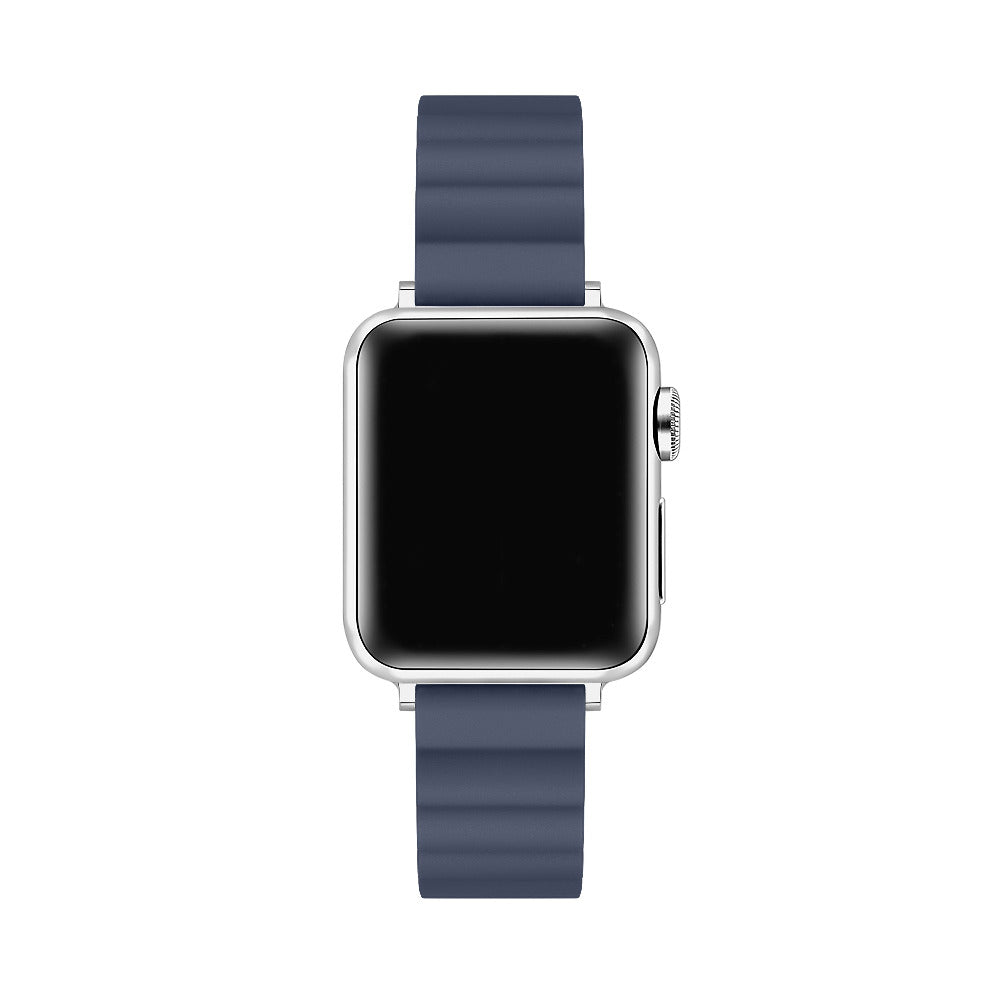 A smartwatch with a silver-toned metal case and a dark navy blue silicone strap, shown from a front-facing perspective on a solid white background.